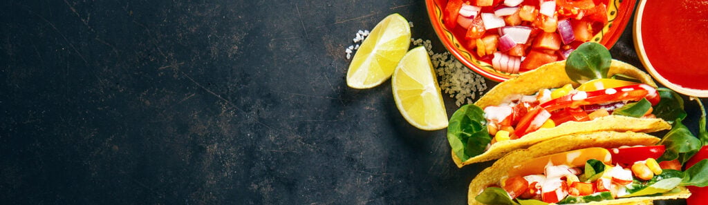 Fresh Mexican tacos with lime and salsa featured on the Las Palapas blog